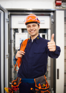 Electrician with thumbs up and tool bag around waist