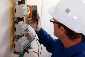 Electrician performing an electrical inspection